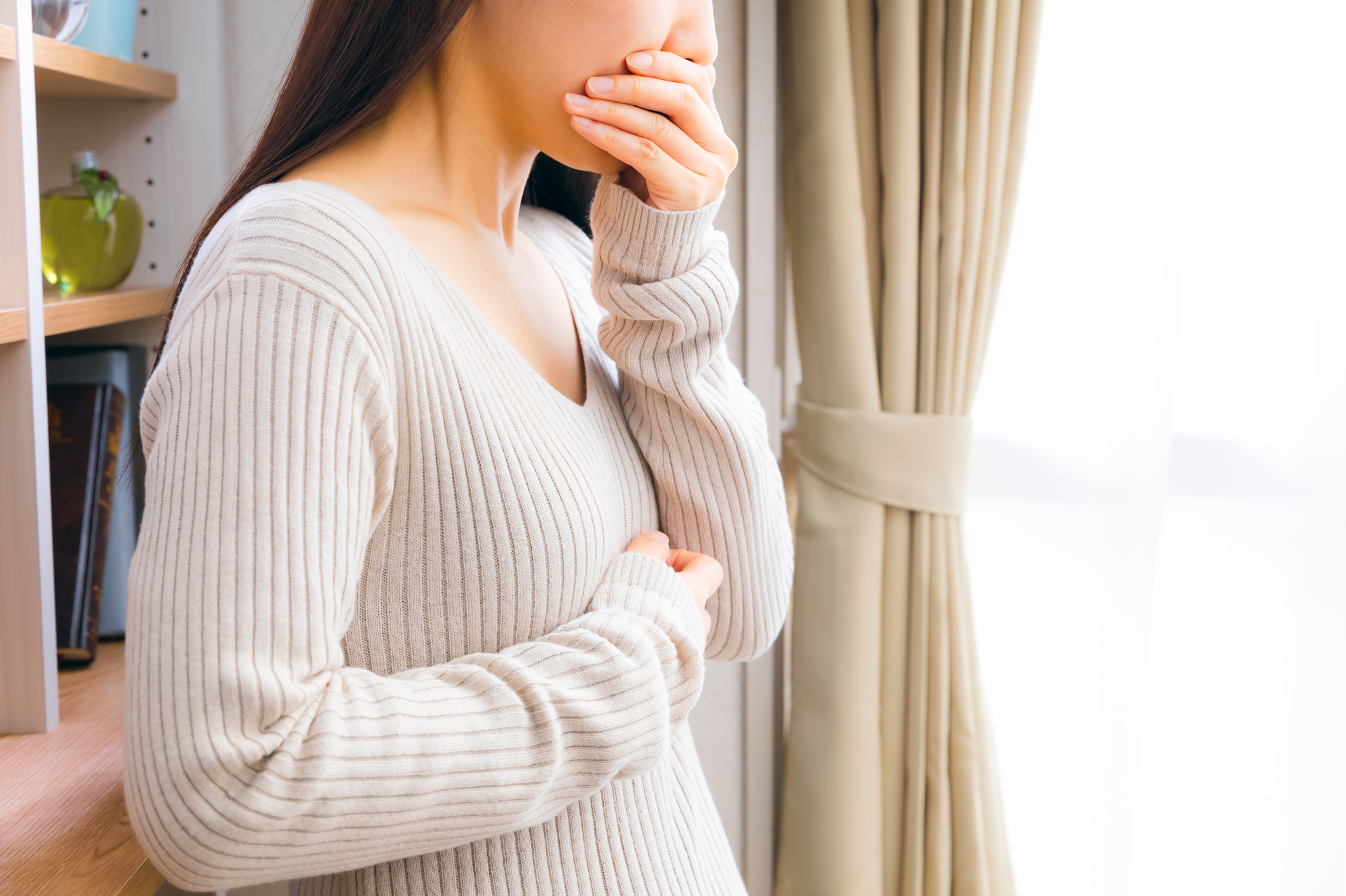 副作用に苦しむ女性の画像